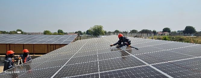 Workers installing solar panels